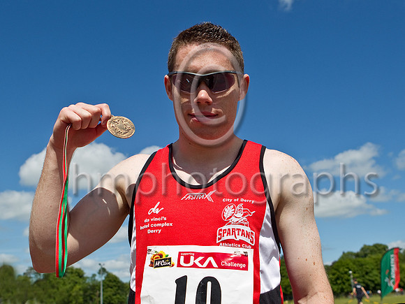Jason Smith of City of Derry Spartans showing off his medal at the NI & Ulster Championships at Antrim.  Jasin broke the NI 100m record running 10:32 seconds - FT8E0684-e23a4j