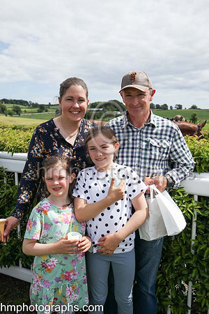 The Ross family - Suzanne and Ronnie with children Hannah and Katie enjoying themselves at The Family Fun Raceday at Downpatrick Race Course on Wednesday 13th July 2022.