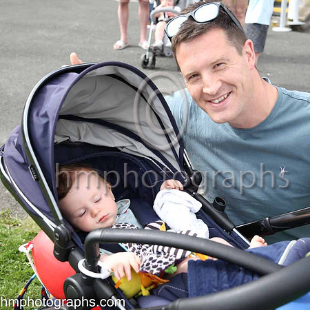 Alastair Kingham from Dromore managiing to get baby Hugo to sleep at The Family Fun Raceday at Downpatrick Race Course on Wednesday 13th July 2022.
