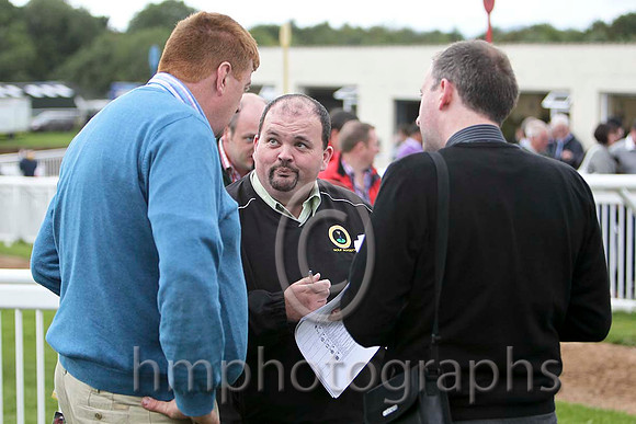 J J Hanlon Trainer of the winner Well Mett gives Justin O'Hanlon of the Irish Racing Post the story of the race - FT8E4052-e