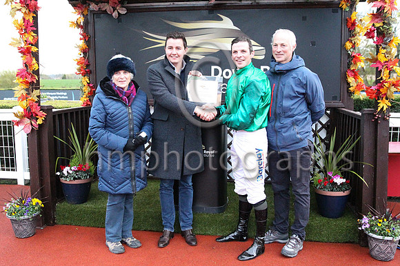 Edith Crawford and Ian McGahey, Sales Director of Workpal, the Race Sponsor after Carnfunnock trained by Stuart Crawford and ridden by his brother Ben won the Workpal Flat Race on Day 1 of the Ladbrok
