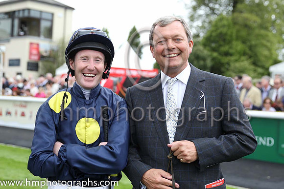 Storm the Stars Jockey Pat Cosgrave and trainer William Haggas in the parade ring at the Curragh before the Dubai Duty Free irish derby