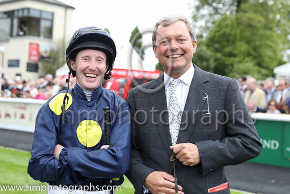 Storm the Stars Jockey Pat Cosgrave and trainer William Haggas in the parade ring at the Curragh before the Dubai Duty Free irish derby