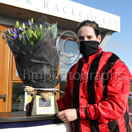 Rachael Blackmore with flowers presented by Downpatrick Racecourse on Sunday at the R andox Ulster National Meeting to mark her six wins at Cheltenham last week.