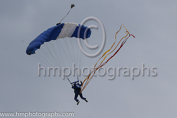 Member of the Irish Parachute Club descending to the track at the Irish Derby at the Curragh