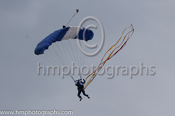Member of the Irish Parachute Club descending to the track at the Irish Derby at the Curragh