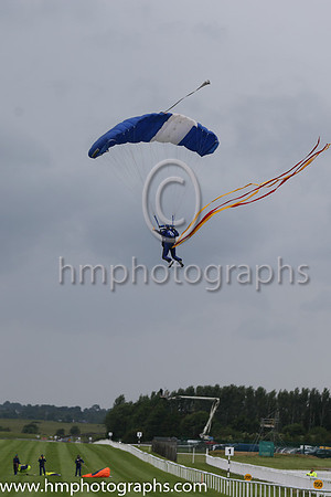 Member of the Irish Parachute Club descending to the track at the Irish Derby at the Curragh
