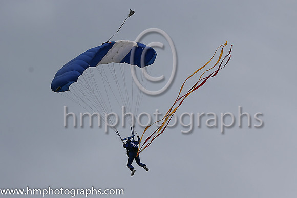 Member of the Irish Parachute Club descending to the track at the Irish Derby at the Curragh