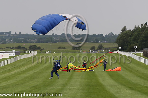 Member of the Irish Parachute Club descending to the track at the Irish Derby at the Curragh