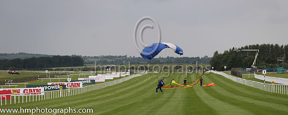 Member of the Irish Parachute Club descending to the track at the Irish Derby at the Curragh