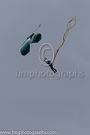 Member of the Irish Parachute Club descending to the track at the Irish Derby at the Curragh
