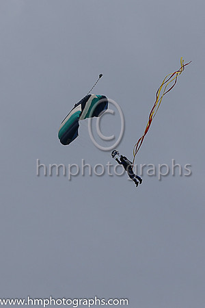 Member of the Irish Parachute Club descending to the track at the Irish Derby at the Curragh
