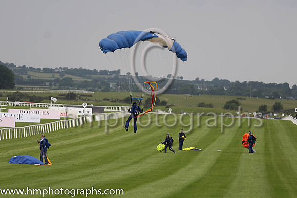 Member of the Irish Parachute Club descending to the track at the Irish Derby at the Curragh