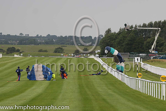 Member of the Irish Parachute Club descending to the track at the Irish Derby at the Curragh