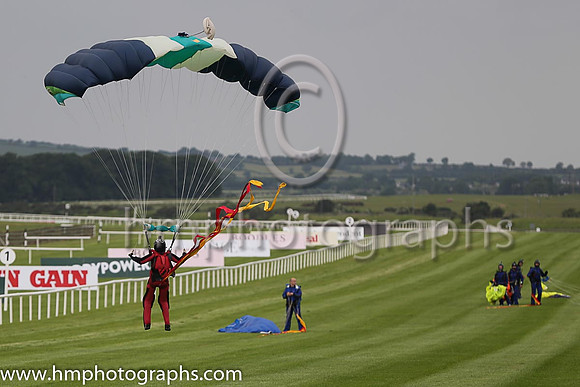 Member of the Irish Parachute Club descending to the track at the Irish Derby at the Curragh