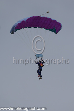 Member of the Irish Parachute Club descending to the track at the Irish Derby at the Curragh