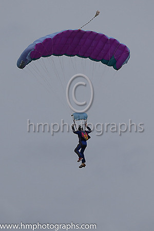 Member of the Irish Parachute Club descending to the track at the Irish Derby at the Curragh
