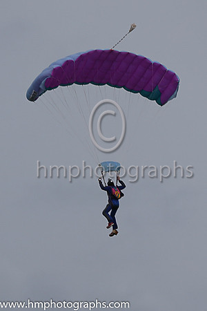 Member of the Irish Parachute Club descending to the track at the Irish Derby at the Curragh