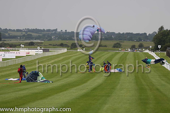 Member of the Irish Parachute Club descending to the track at the Irish Derby at the Curragh