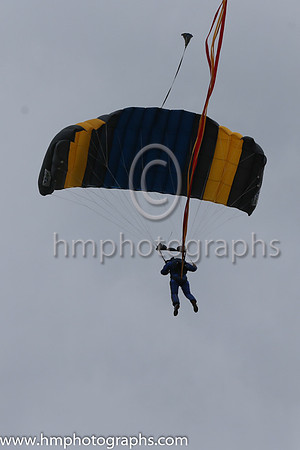 Member of the Irish Parachute Club descending to the track at the Irish Derby at the Curragh