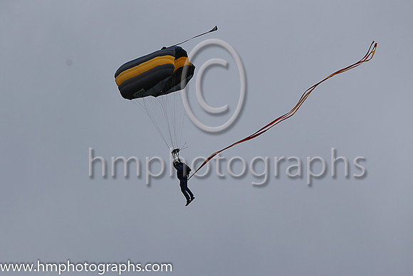 Member of the Irish Parachute Club descending to the track at the Irish Derby at the Curragh