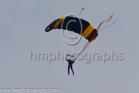 Member of the Irish Parachute Club descending to the track at the Irish Derby at the Curragh