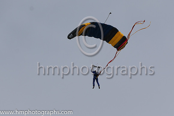 Member of the Irish Parachute Club descending to the track at the Irish Derby at the Curragh