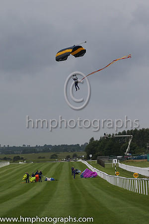 Member of the Irish Parachute Club descending to the track at the Irish Derby at the Curragh