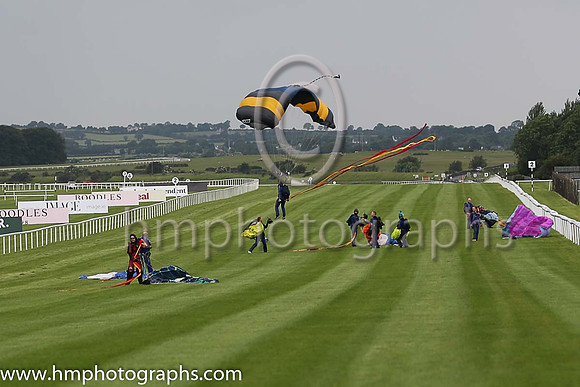 Member of the Irish Parachute Club descending to the track at the Irish Derby at the Curragh