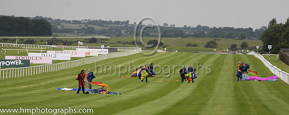 Membesr of the Irish Parachute Club descending to the track at the Irish Derby at the Curragh