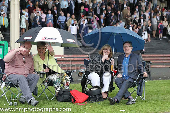 Spectators at the Irish Derby at the Curragh making themselves comfortable