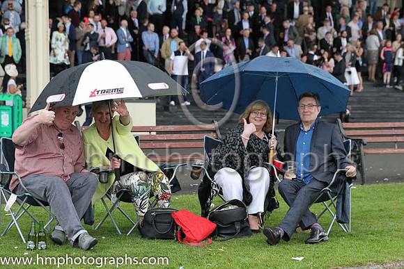 Spectators at the Irish Derby at the Curragh making themselves comfortable