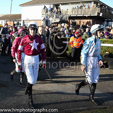 Jockeys enter the parade ring for the jnwine.co Champions Chase