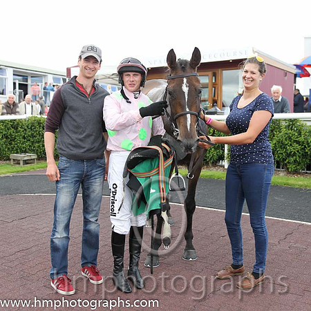 Race 2 - Patrick Mullins and winning jockey Paul Townend with Childrens List and stable girl