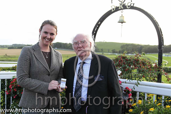 Ruth Black present Tommy Carson with a Diamond Ring which he won in a draw at Downpatrick