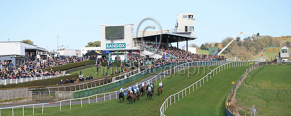Horses climb the hill at Downpatrick in front of large crowds in the Randox Ulster National.