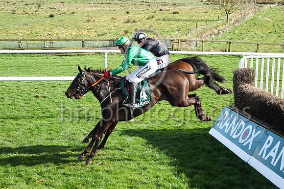 Malina Girl (4, Green silks) ridden by Keith Donoghue jump the last to go to win the Randox Ulster National Handicap Steeplechase at DOnwpatrick on 2nd April 2023. Maina Girl is trained by Gavin Cromw