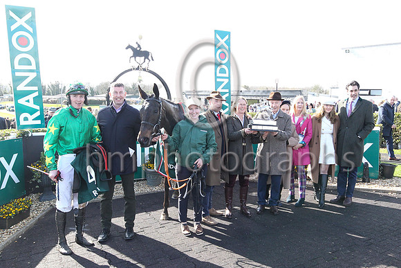 Dr Peter FitzGerald CBE FREng DL, Randox Managing Director presenting the trophy to the winning owner Mrs J M Russell after Malina Girl won the Randox Ulster National Handicap Steeplechase at Downpatr