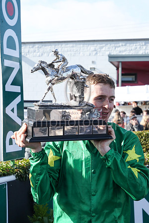 Keith Donoghue with the trophy after winning the Randox Ulster National Steeplechase at Downpatrick on 2nd April 2023