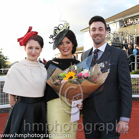 Sarah McEvoy from Jonesborough winner of the Victoria Square Best Dressed Lady Competition at Down Royal with judges Katherin Ferries Victoria Square Stylist and Guy Niel NI Gossip