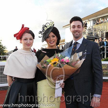 Sarah McEvoy from Jonesborough winner of the Victoria Square Best Dressed Lady Competition at Down Royal with judges Katherin Ferries Victoria Square Stylist and Guy Niel NI Gossi