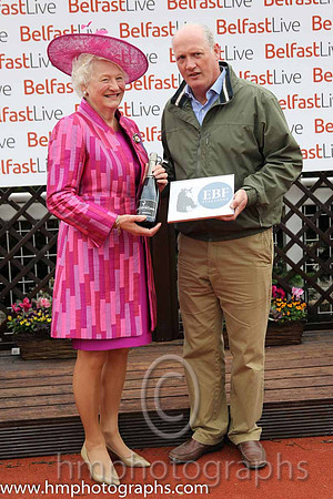 Dame Mary Peters presents the prize to winning trainer Willie McCreery