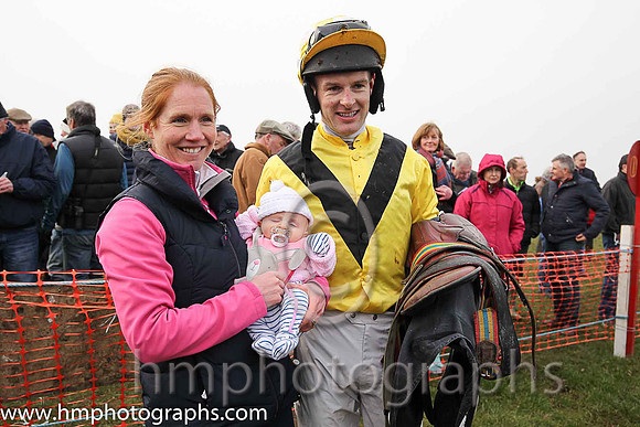 Mark O'Hare wife Sarah and 7 week old baby girl Penny in the parade ring after Mark's win on Sixteen Again at Tynan and Armagh Point to Point Races