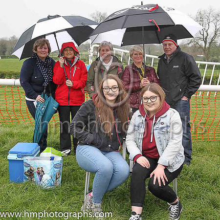 Ballymena Picnickers take shelter at the Mid-Antrim Hunt P2P - back row - Grace O'Neill, Karen Kernohan, Rosemary Beggs, Joy Herron, Michael O'Neill. Front row - Lauren Kernohan and Ciara Caulfield