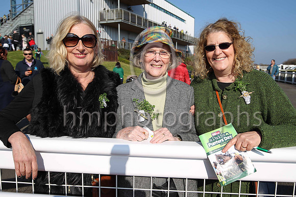 Jane O'Neill, Delores Black and Delores Vischer from Belfast wearing the shamrock at Down royal on St Patricks Day