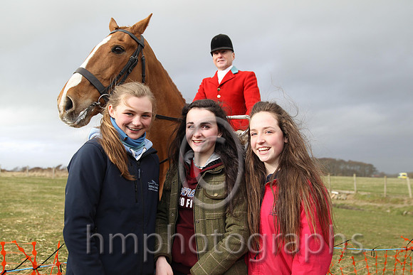 Huntsman Declan Feeney oversees friends Toni Quail, Tiarna Drake and Aimee Hamilton at Tyrella Point to Point