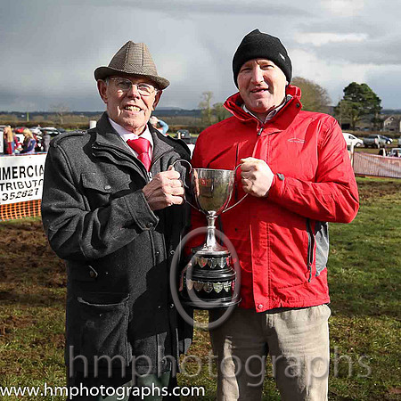 Bob McKnight Master of East antrim Hounds presents the Stirling Perpetual Challenge Cup to winning owner Peter Lawlor