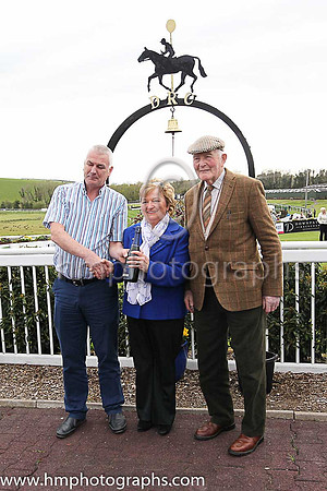 Gertrude and Aubrey Steele celebrating their 50th wedding anniversary present the prize to winning trainer Brendan Flynn