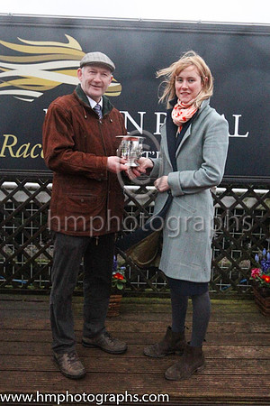 James Coen from Galway owner of winner Dazzling Sarah receiving his trophy from Molly McCluskey of Down Royal
