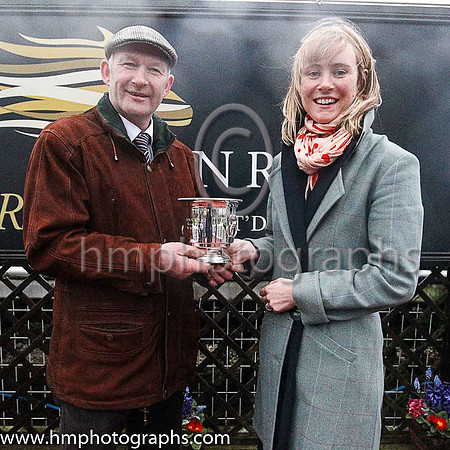 James Coen from Galway owner of winner Dazzling Sarah receiving his trophy from Molly McCluskey of Down Royal